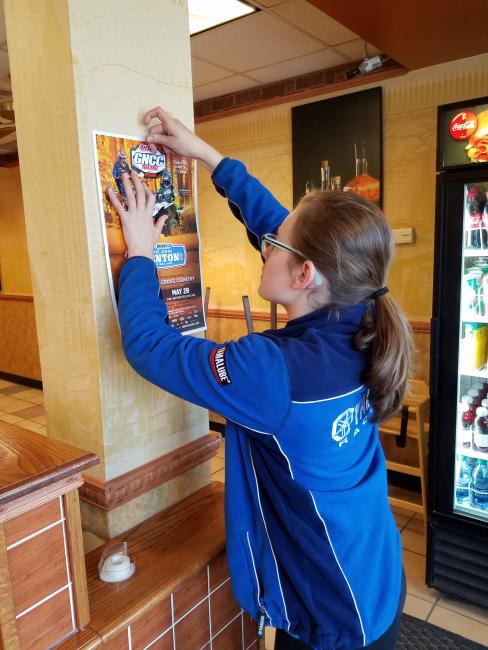 Morgan Johnson placed GNCC posters throughout her hometown.