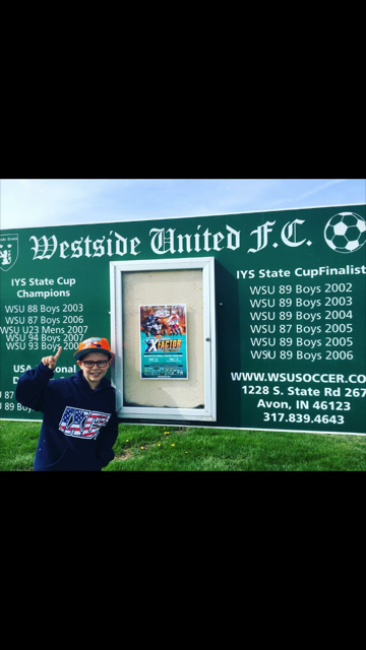 Cray Fair shows off the GNCC poster he hung in his hometown!