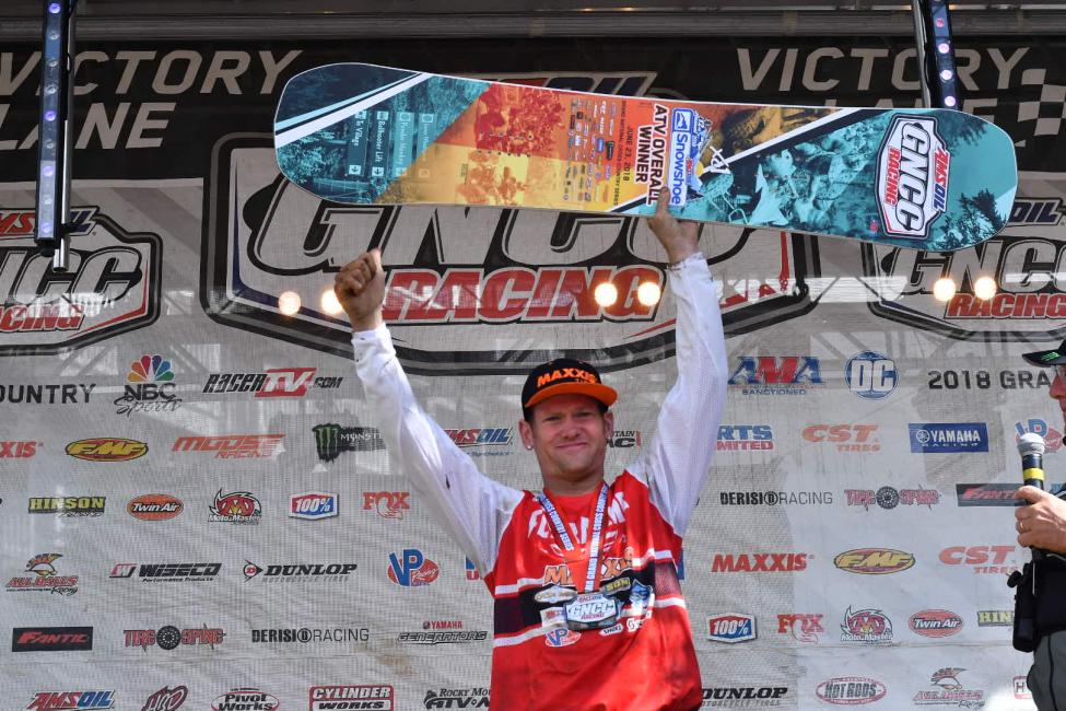 Chris Borich holds up his overall trophy after earning his first win of the 2018 season.