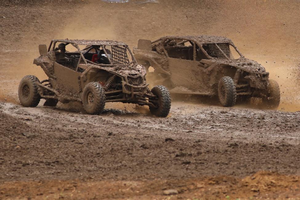 A very mud-covered Tim Farr (left) and Kyle Chaney battled for the win all the way to the checkers in their Can-Am Maverick X3 side-by-side vehicles at round five. Farr ended up with the victory, his first this year.