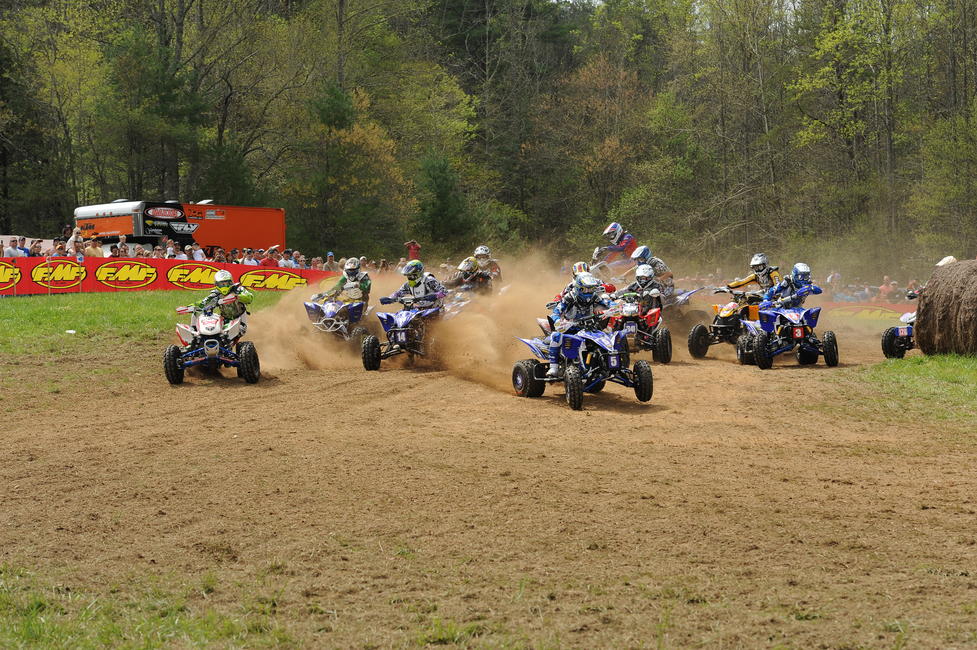 And last but not least, here's an XC1 ATV start from Steele Creek 2012. That's Dustin Canipe on the far left along with Kevin Yoho (10), Johnny Gallagher (14), Walker Fowler (5), Brian Wolf (341), Chris Bithell (4) and Taylor Kiser (3). And if you're wondering why the rider in the very back looks like he's going the wrong way, well, that's Adam McGill. If you know anything about Adam, the simple fact that it's Adam should explain why he's headed away from everyone else. Just kidding, Adam!