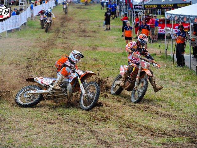 Jason Thomas going in for a pass on Kailub Russell during lap 1 of the XC1 Pro class racePhoto: Courtesy of DirtWise