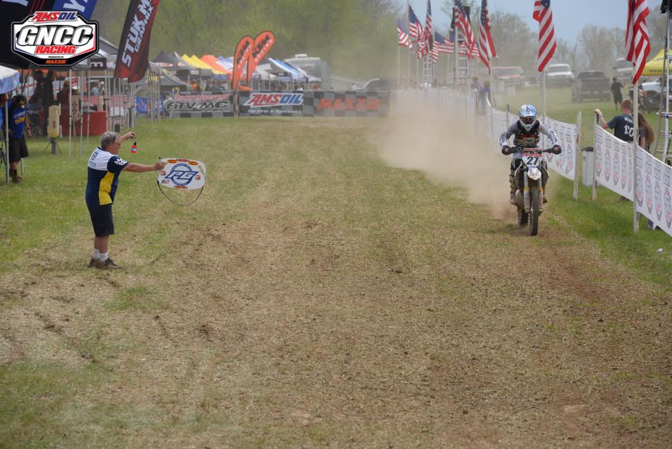 Craig DeLong passing up a beverage heading down Pro row at the Limestone 100 GNCCPhoto: Ken Hill