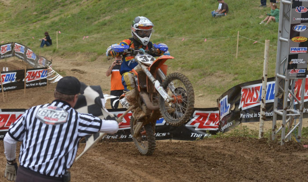 Youth Rider, Kevin Johnson, finishes the John Penton GNCC after some rainfall made it very slick. 