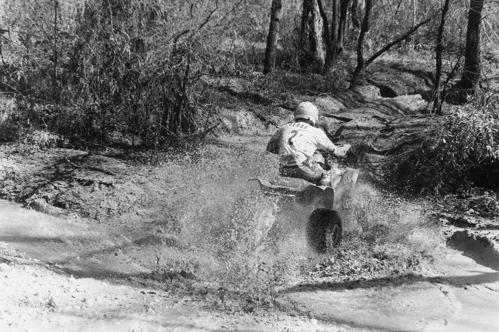 Here, the great Bob Sloan splashes through a creek in the 1991 Stateline GNCC in North Carolina