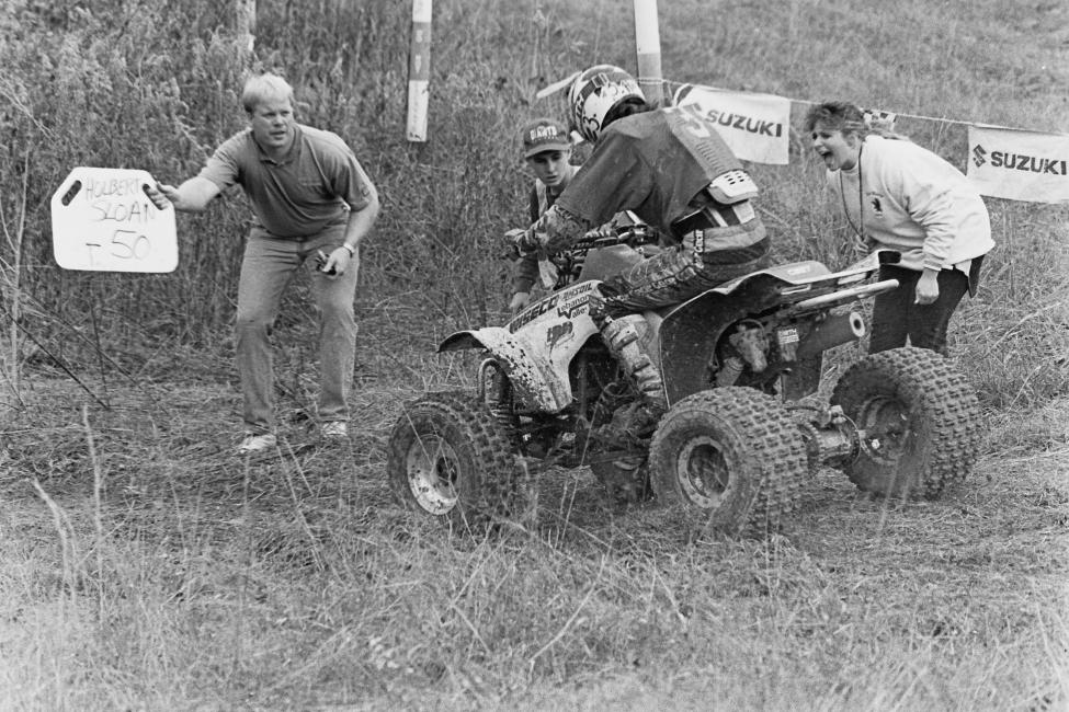 Here’s a good one from the 1993 Volunteer 100 GNCC in Tennessee. Barry Hawk gets a pitboard telling him he’s third behind Steve Holbert and Bob Sloan while Kristen (Barry’s wife) lets him know that if he doesn’t catch up with them, he’s walking back to Pennsylvania. Photo: GNCC Archives