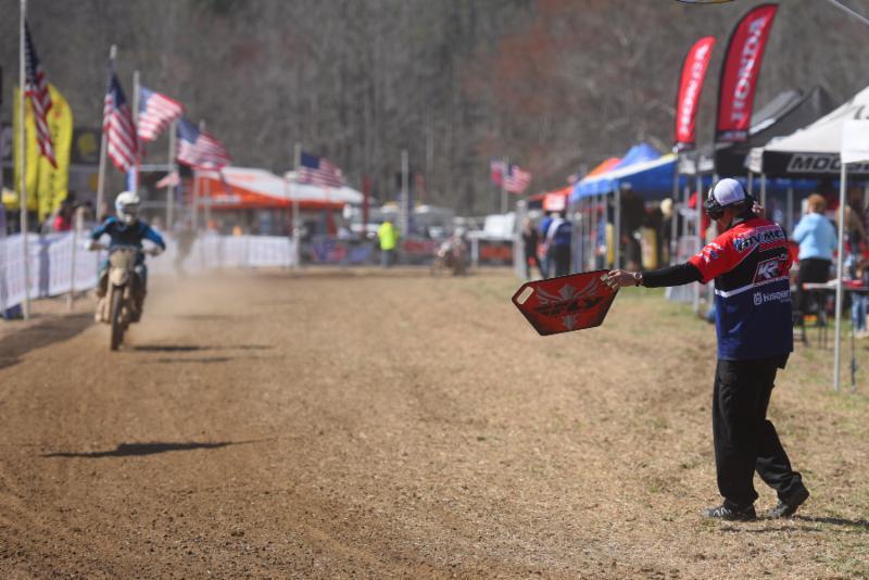Team Manager Fred Andrews signaling Nick Davis in the pro pits