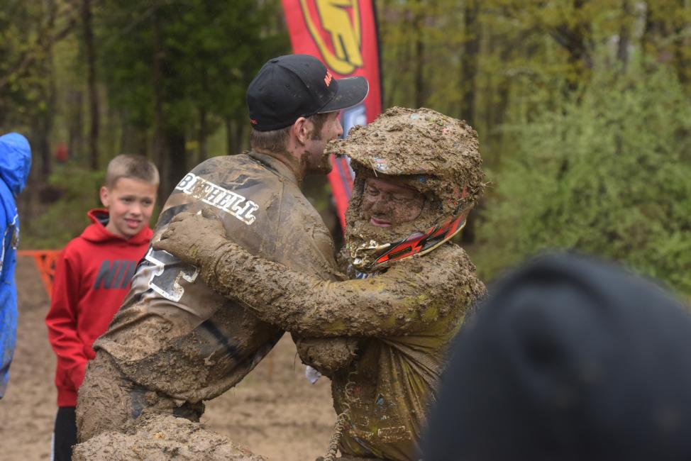 Chris Bithell and Chris Borich congratulate each other after a muddy race at round five.  Photo: Ken Hill