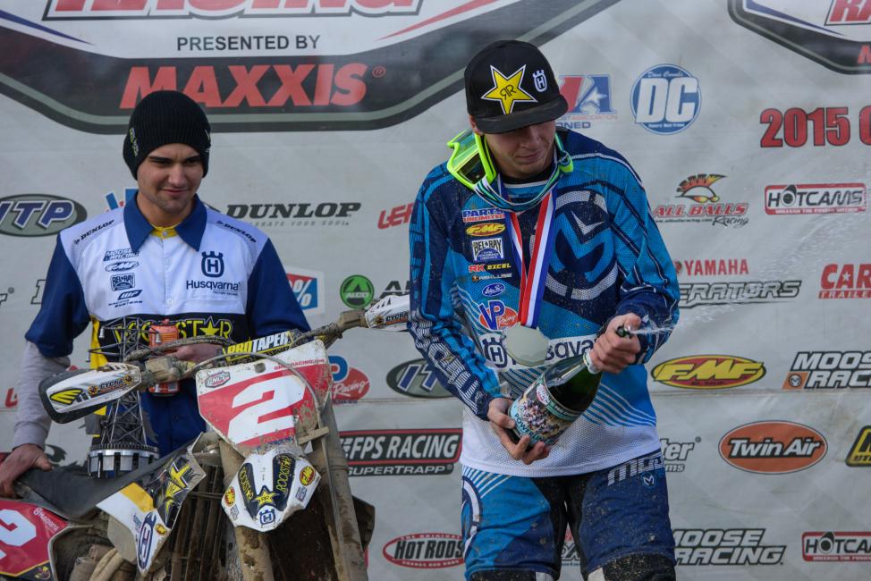 Josh Strang celebrating his win on top of the podium.