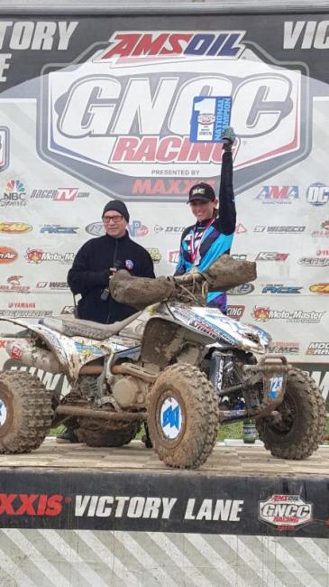 Honda racer Angel Knox held up her official GNCC National Champion No. 1 plate after winning the WXC class at Powerline Park in Ohio. Se secured the title one round prior to the finale, and successfully posted back-to-back championships.
