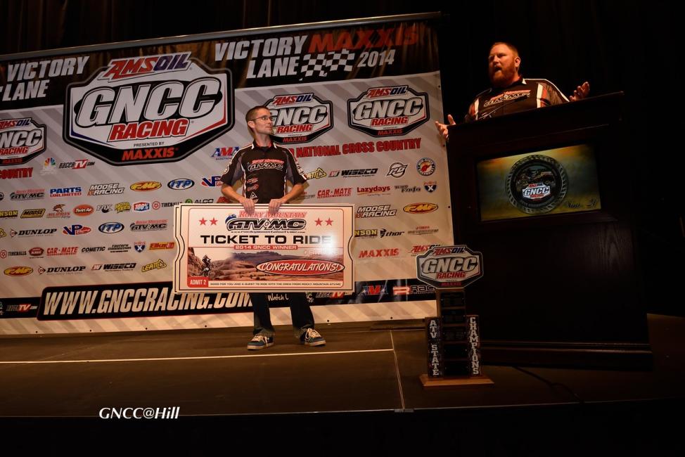 Ray Butts and Justin Deschamps of Rocky Mountain ATV/MC award the Ticket To Ride to the lucky GNCC racers.Photo: Ken Hill