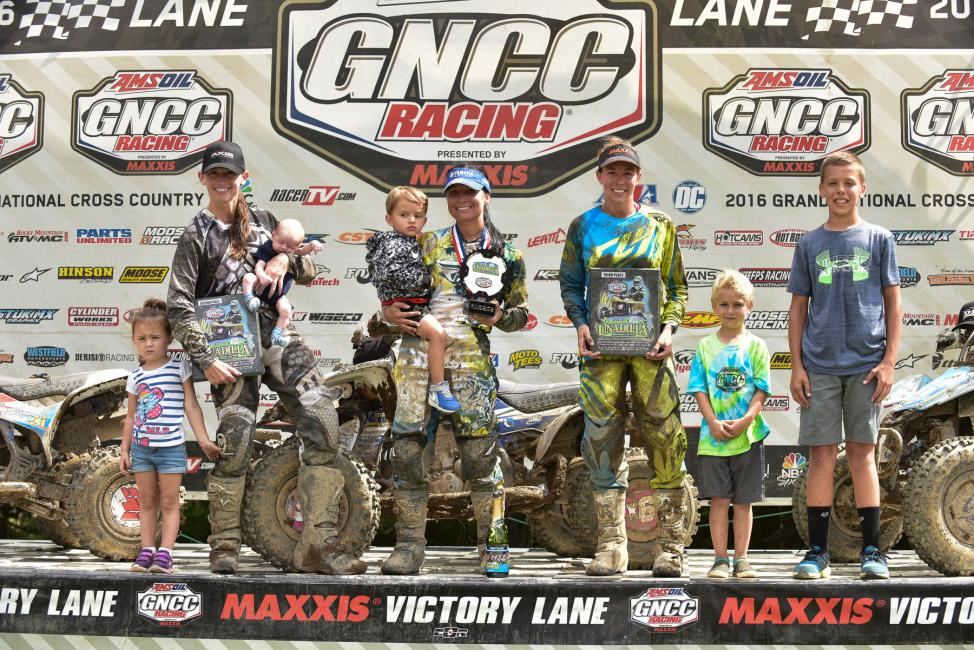 Traci Pickens (center), Angel Knox (left) and Alicia McCormick (right) pictured with their children rounded out your WXC ATV class podium at Unadilla.  Photo: Ken Hill
