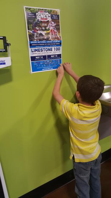 Dalen Lane helped out for the Limestone 100 by placing posters around town to inform the public of the upcoming GNCC race in Springville, Indiana. Photo: Provided