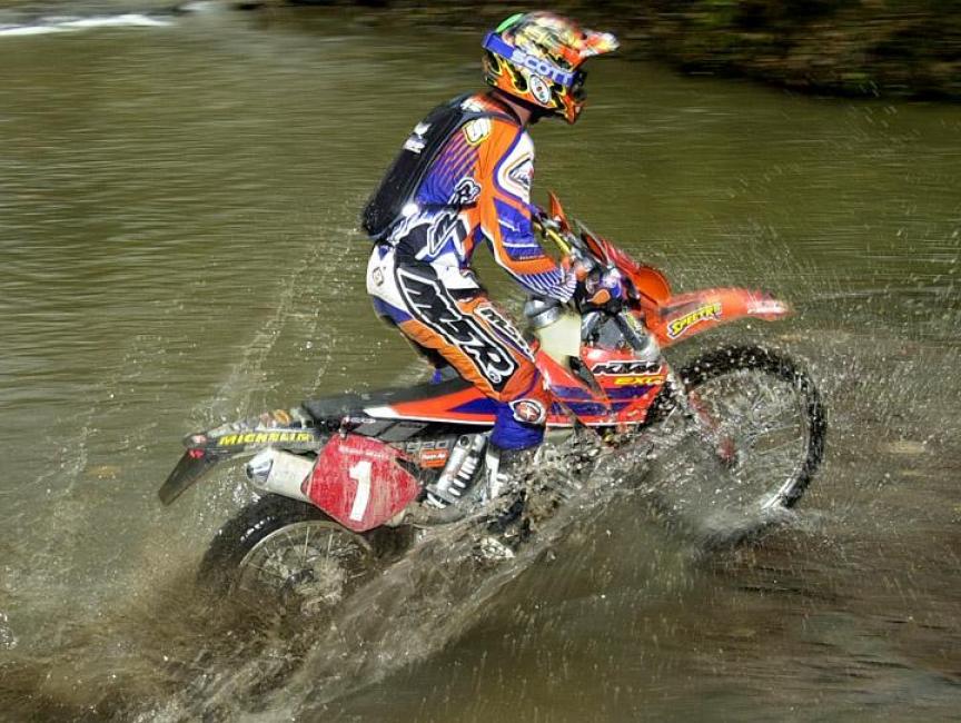 Shane Watts splashes through the creek at Ironman in 2001.