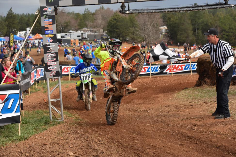 Youth rider, Peyton Whipkey, wheelies to a win Sunday morning. 