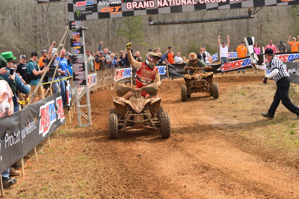 Neal celebrates as he crosses the finish line first in Georgia.