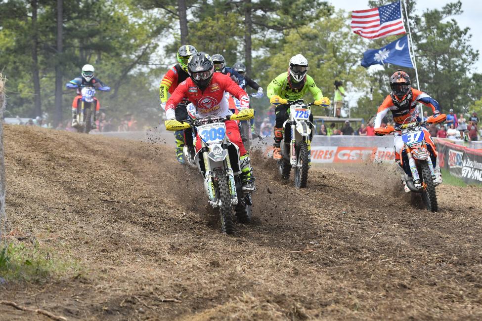 Alex Teagarden (#309) grabbed the FMF XC3 125 Pro-Am holeshot, but Jesse Ansley (#37) was hot on his heels.