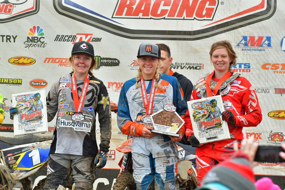 Becca Sheets (center), Tayla Jones (left) and Rachel Gutish (right) rounded out the top three at Powerline Park in Sunday's WXC class.