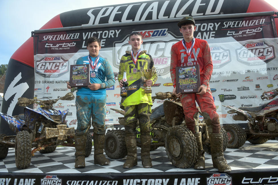 Damien Hawkins (center), Bryce Husband (right) and Parker Henderson (left) made up the youth overall podium at Steele Creek.