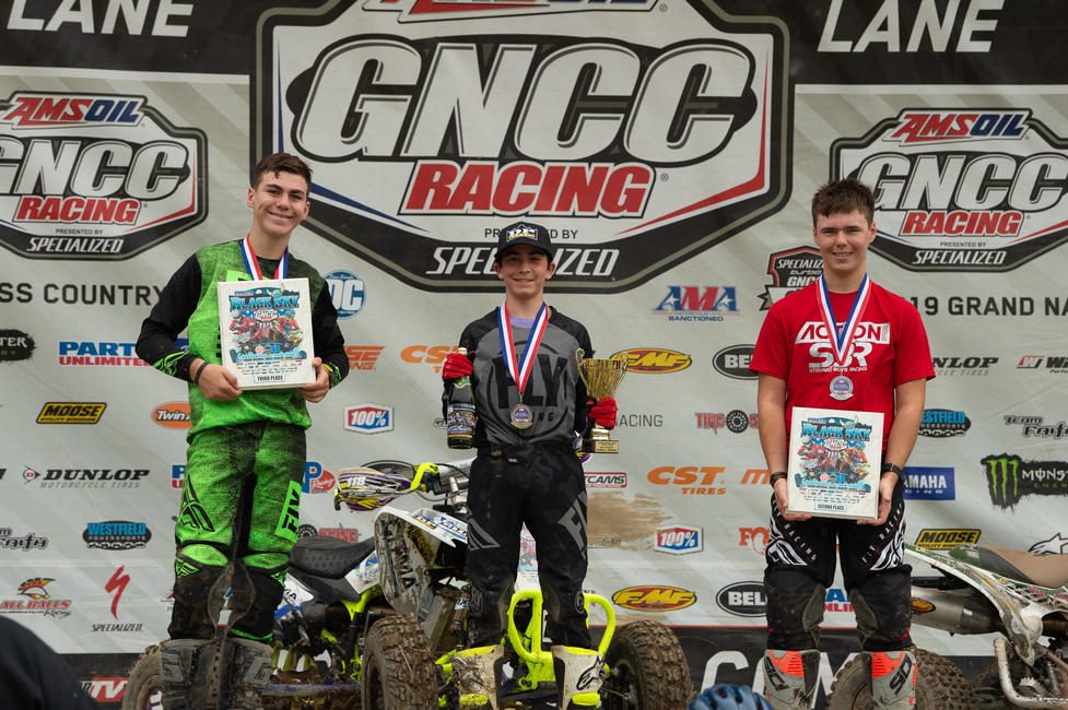 Carson Collins (center) earned the youth overall win, followed by Cooper Stewart and Charlie Stewart in second and third. 