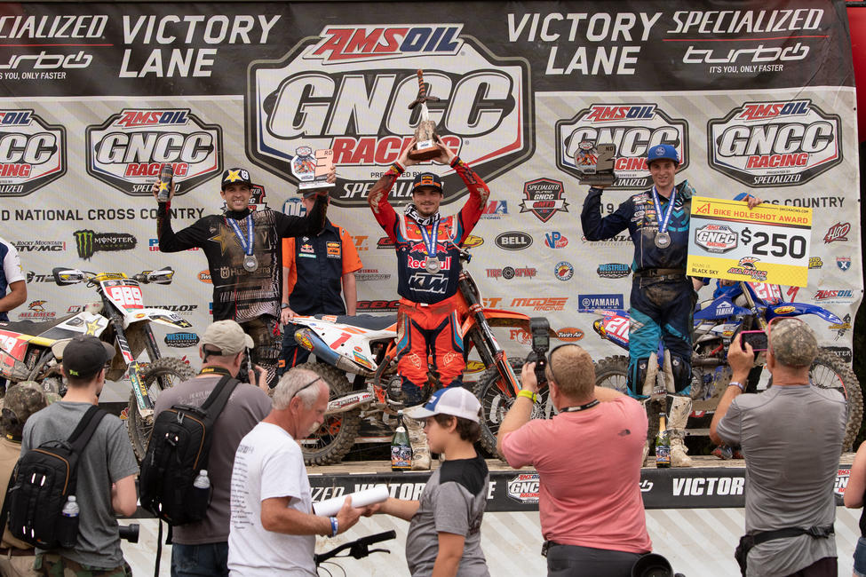 Kailub Russell (center), Ricky Russell (right) and Thad Duvall (left) rounded out the overall Parts Unlimited Black Sky GNCC podium.