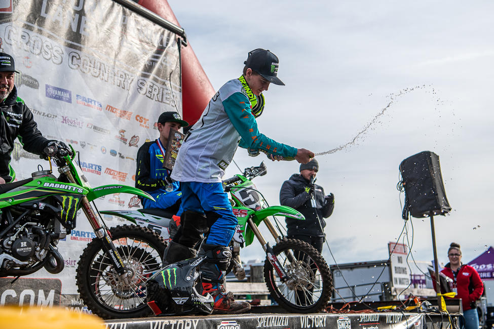 Grant Davis celebrates his win with some champagne showers AKA sparkling grape juice for the youth.
