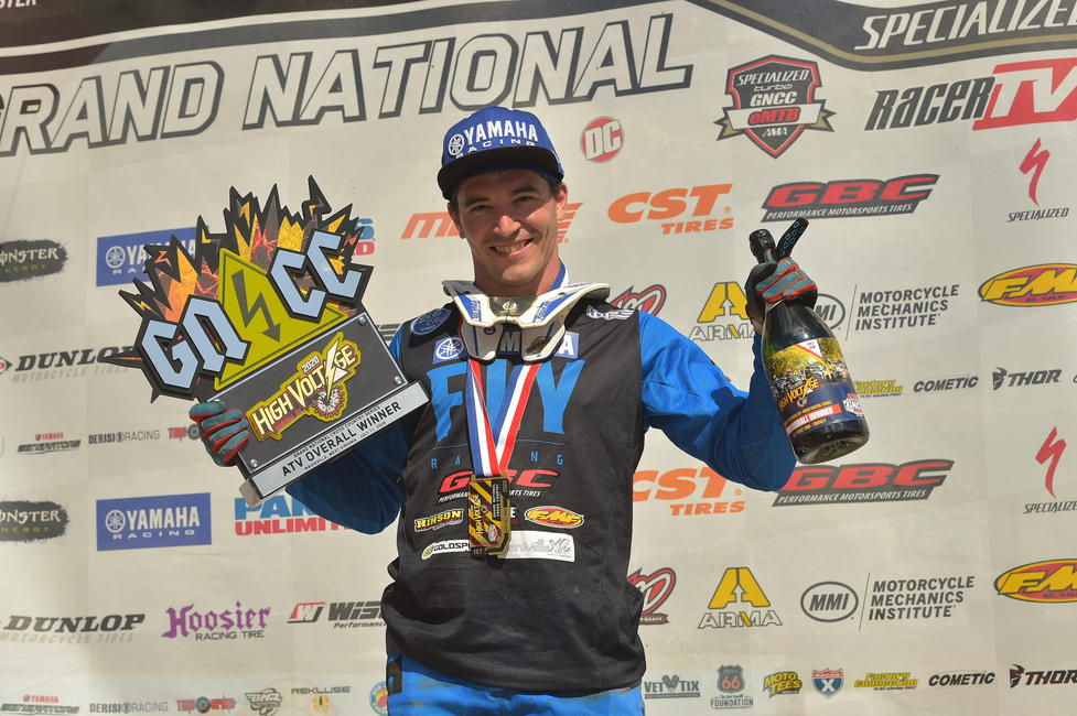 Walker Fowler atop the podium with the High Voltage GNCC ATV Overall Winner trophy in hand.