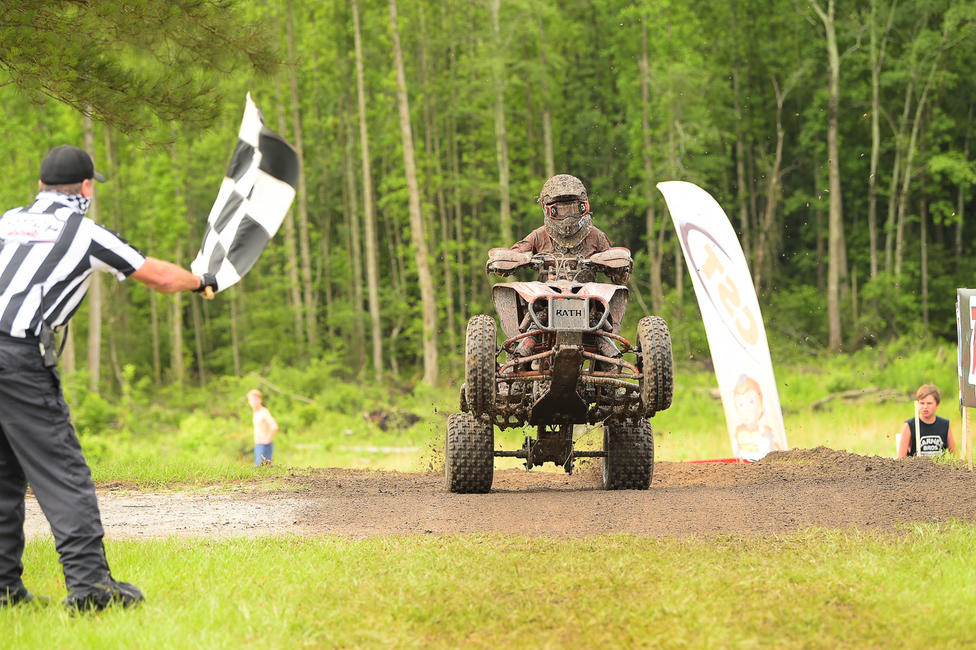 Cox taking the checkered flag back at the Camp Coker Bullet GNCC. Photo: Ken Hill