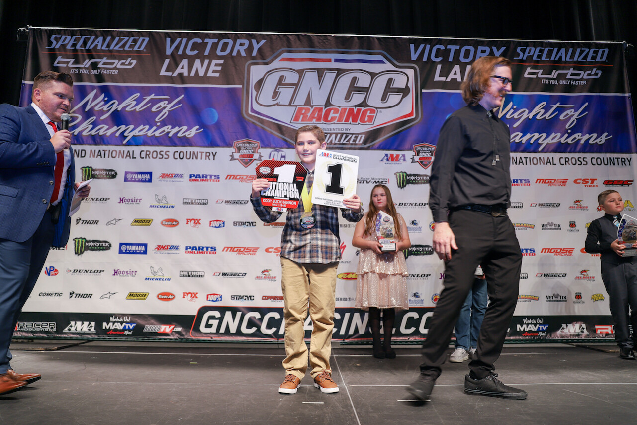 Buckhannon accepting his number one plate and National Championship plate at the 2021 GNCC Banquet. Photo: Derek Garcia
