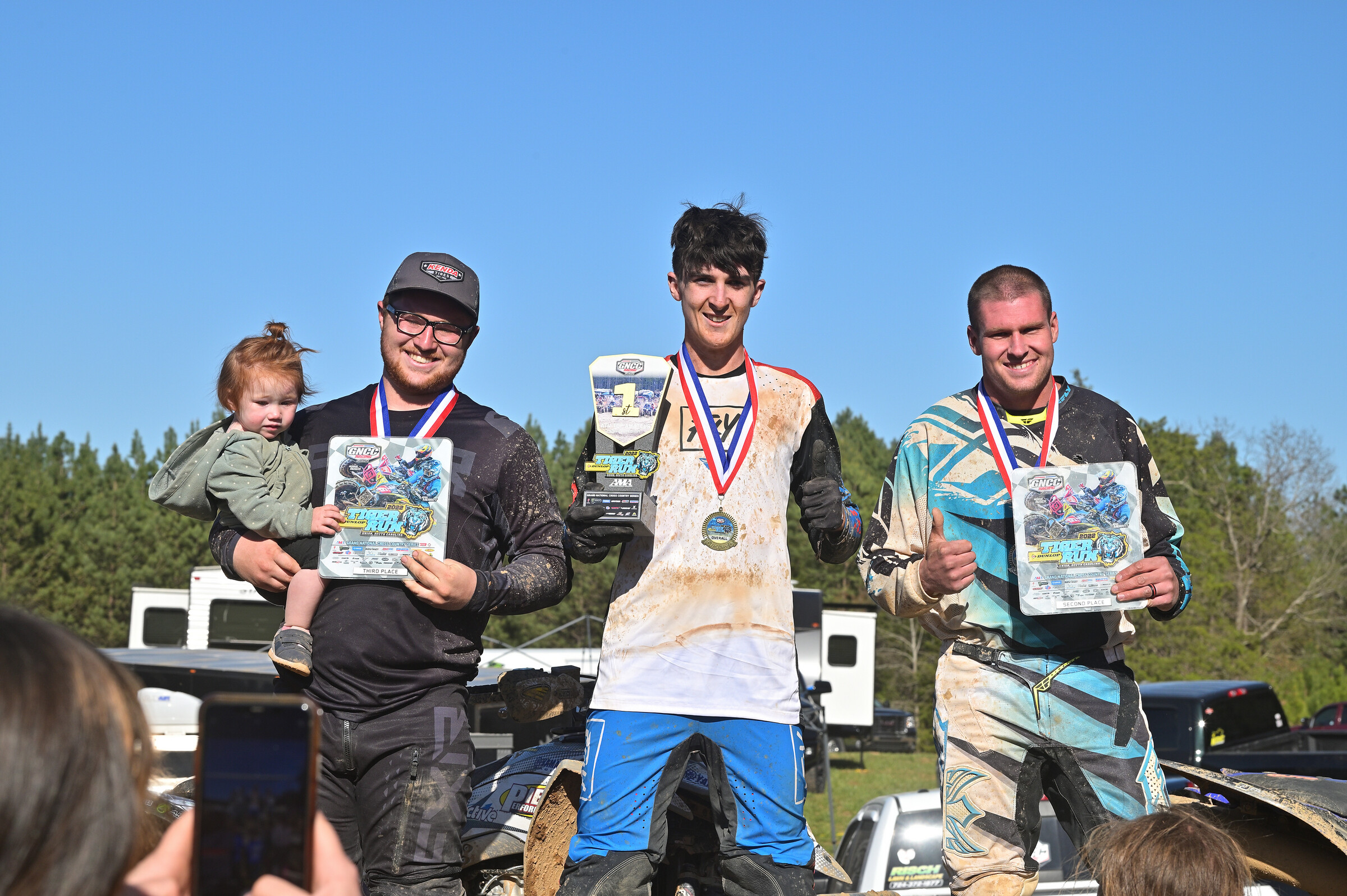 Seth (left) on the ATV Top Amateur podium with his daughter. 