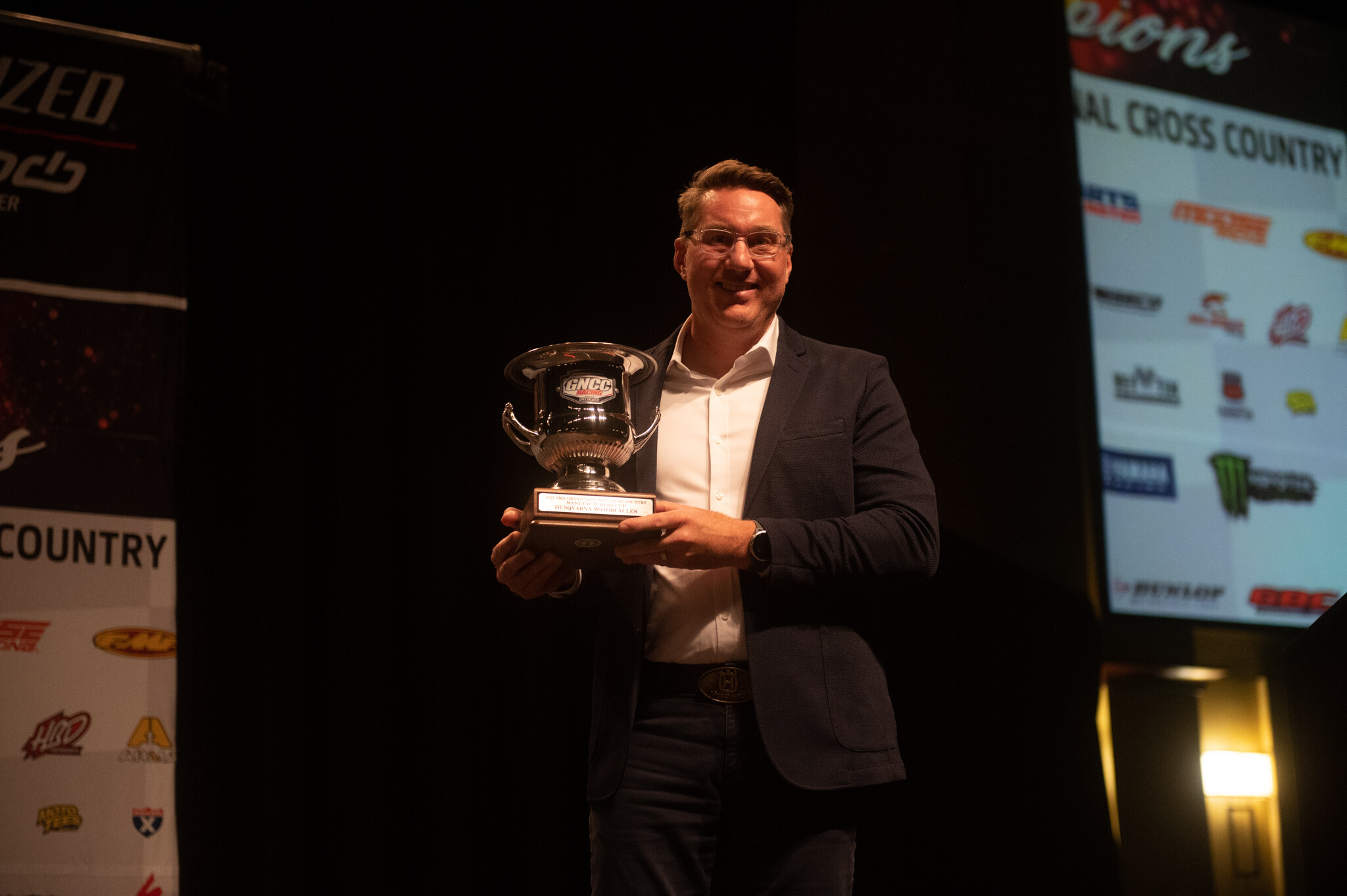 John Hinz accepting the Manufacturers cup for Husqvarna Motorcycles.