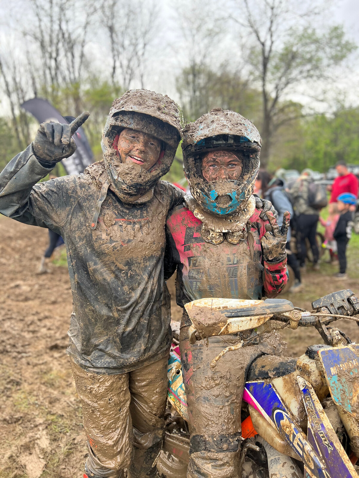 Zoey Kimble and Maddison Harmon after their muddy morning race on Sunday.