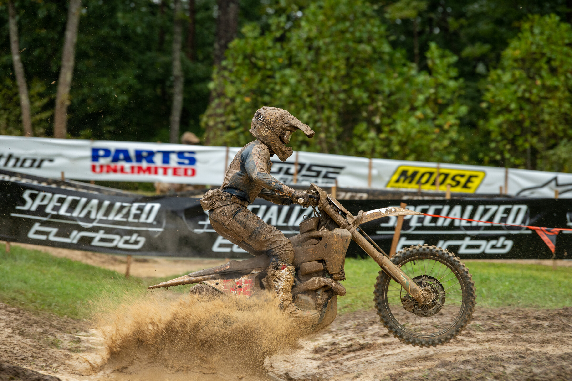 DeLong splashing through the mud at round 10, The Mountaineer.