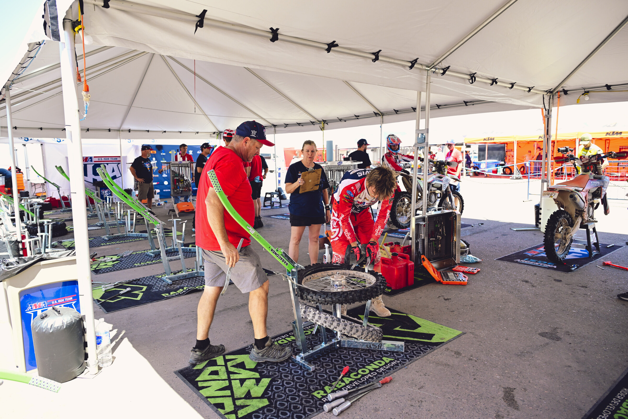 Grant Davis changes his tire after day 3.