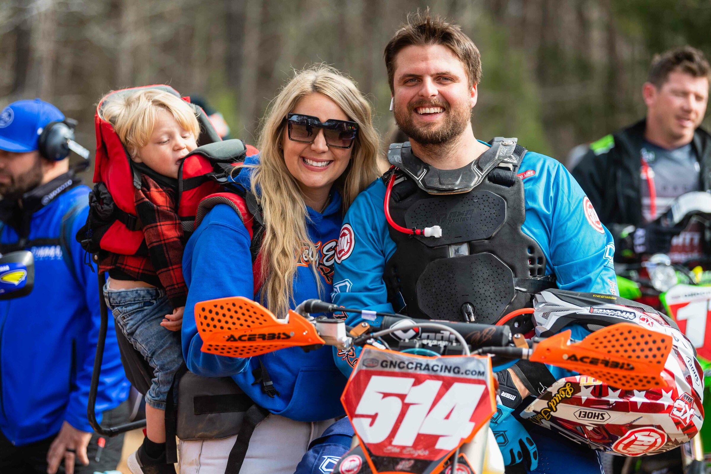 Baylor, his wife Jade and son Levi before the start of a race this season.