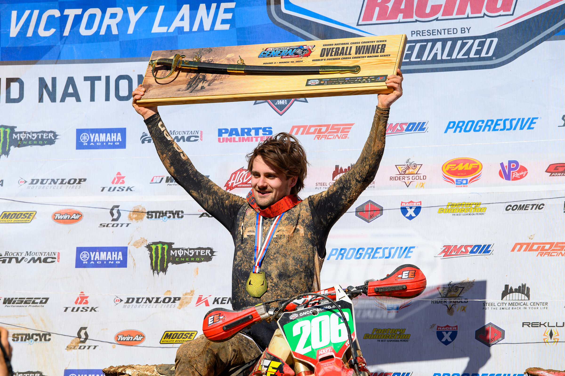 Toth atop the podium with his overall winner trophy.