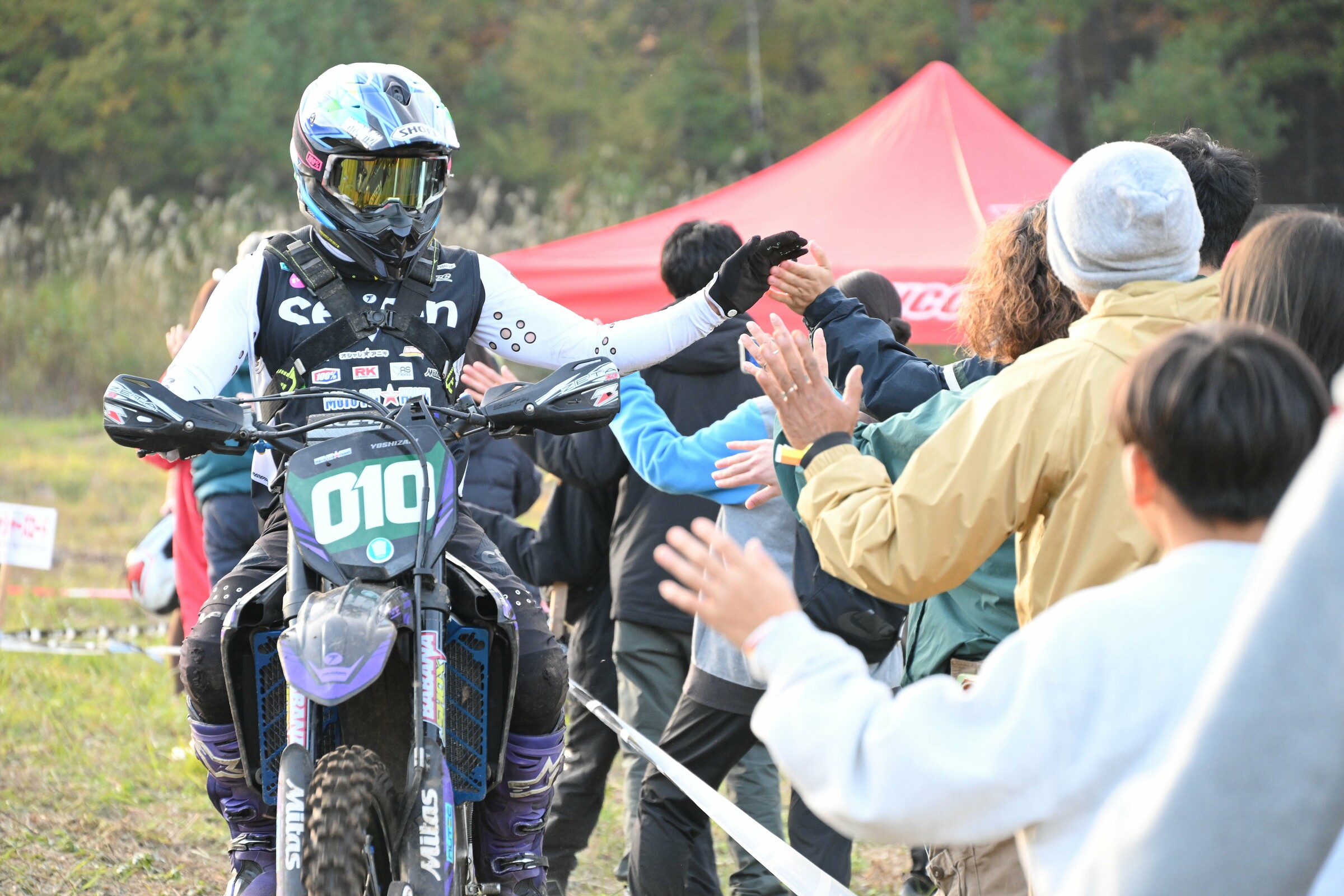 Kazushiro Yoshizaki earns some congratulations after finishing.
