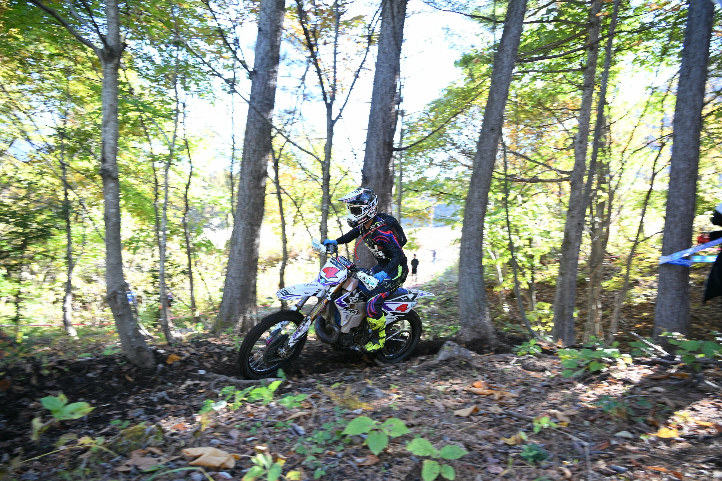 Suzuki Ryota ironically rides a Yamaha.