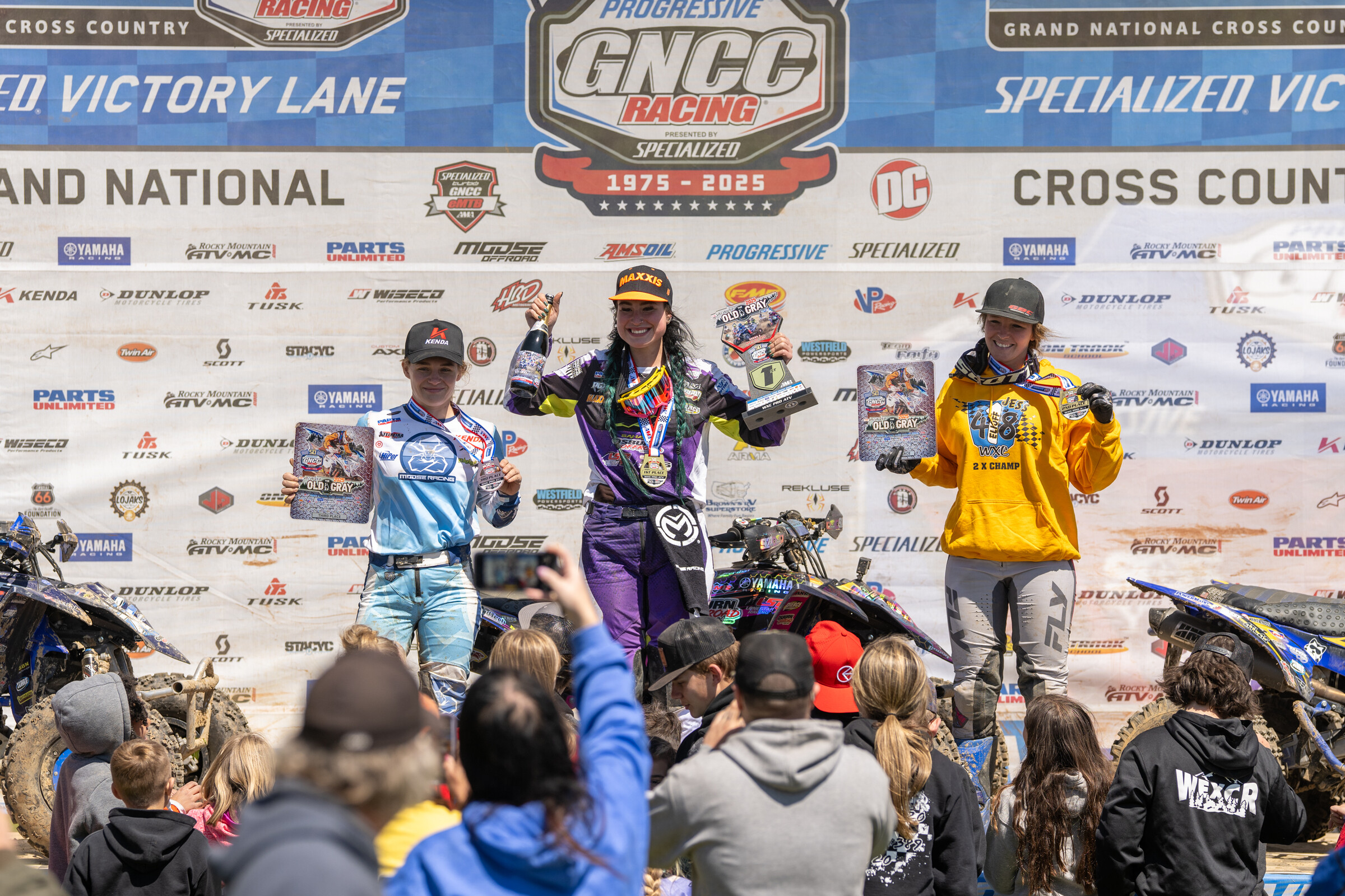 Chloe Harper (center), Jessica Elioff (right) and Hannah Hunter (left) rounded out the top three WXC class finishers.