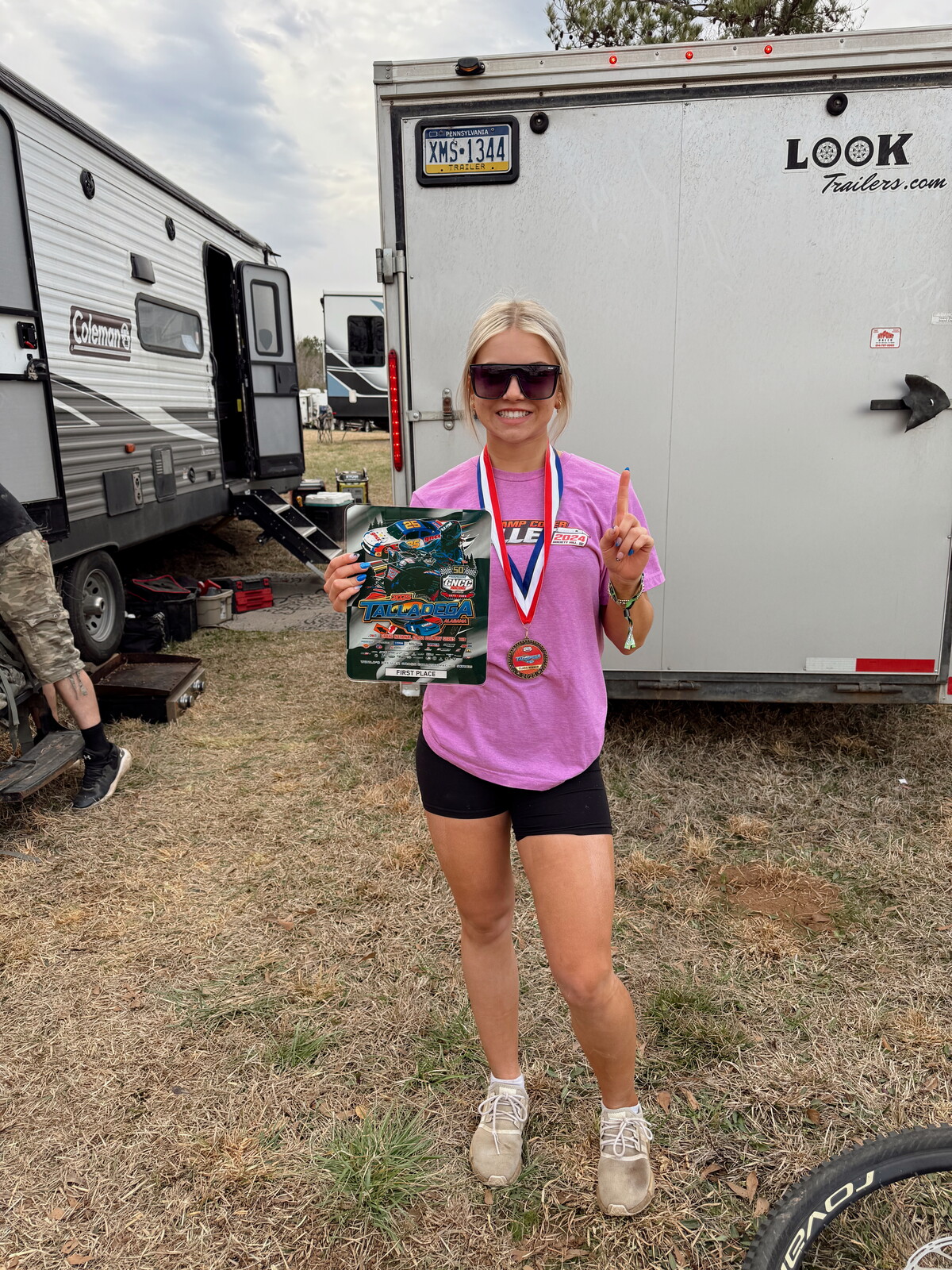 Hannalyn and her first place plaque and medallion from the Talladega GNCC.